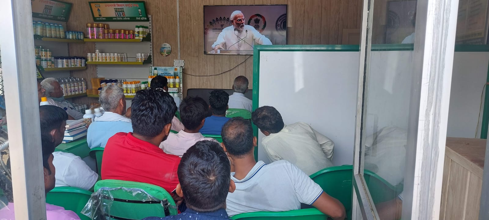 Farmers watching a live agricultural programme at a service centre